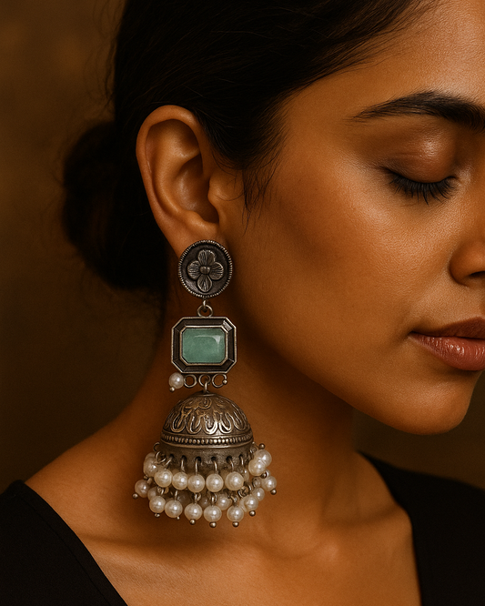 Elegant Oxidized Silver Jhumka Earrings with Green Stone and Pearl Detailing